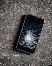 a broken cell phone on the ground